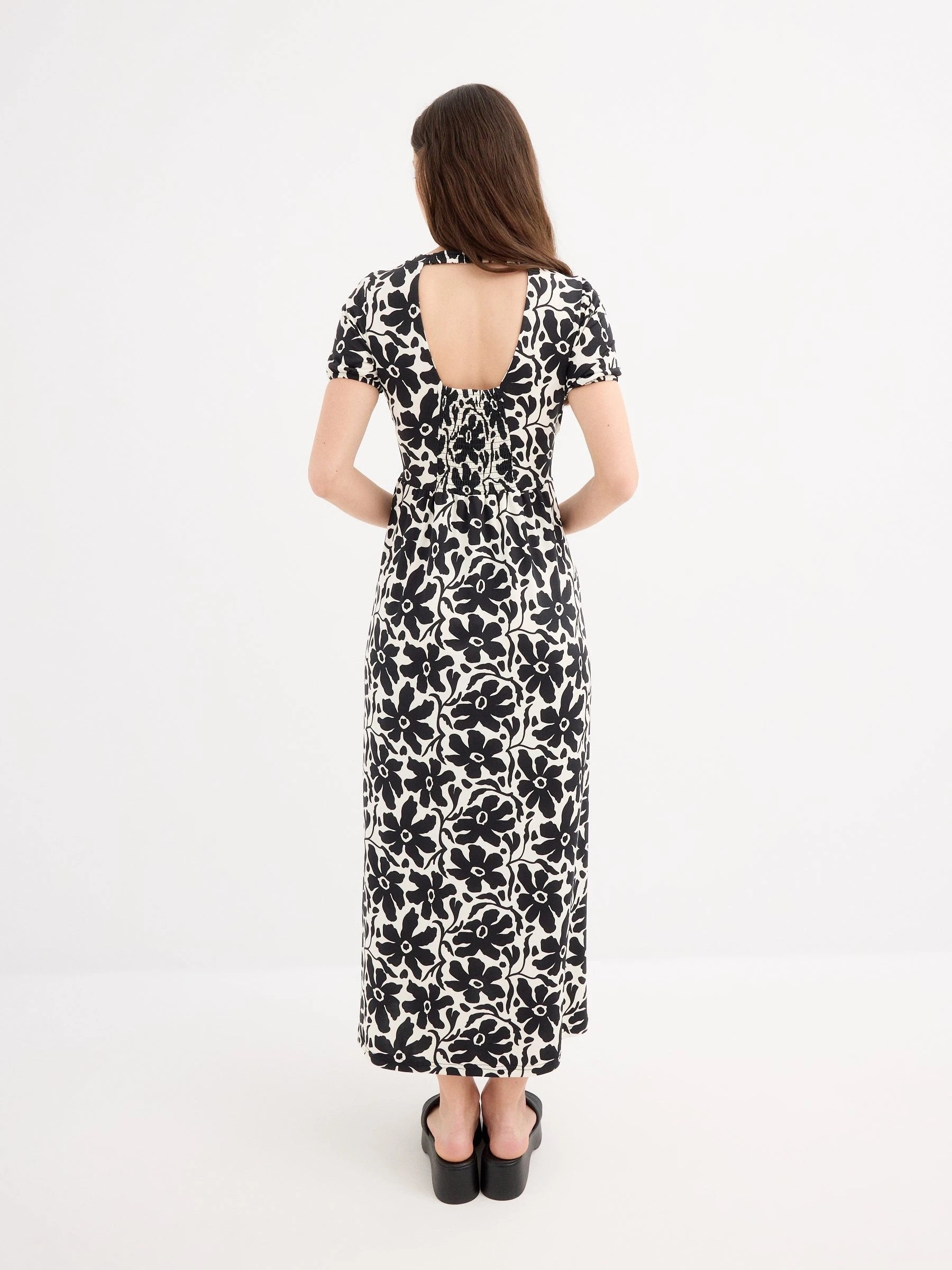 Maxi printed dress with V-neck and short sleeves by Inside, made from soft polyester-elastane blend, featuring button front closure and partially exposed back, perfect for casual everyday wear, ideal for women looking for sty