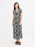 Maxi printed dress with V-neck and short sleeves by Inside, made from soft polyester-elastane blend, featuring button front closure and partially exposed back, perfect for casual everyday wear, ideal for women looking for sty